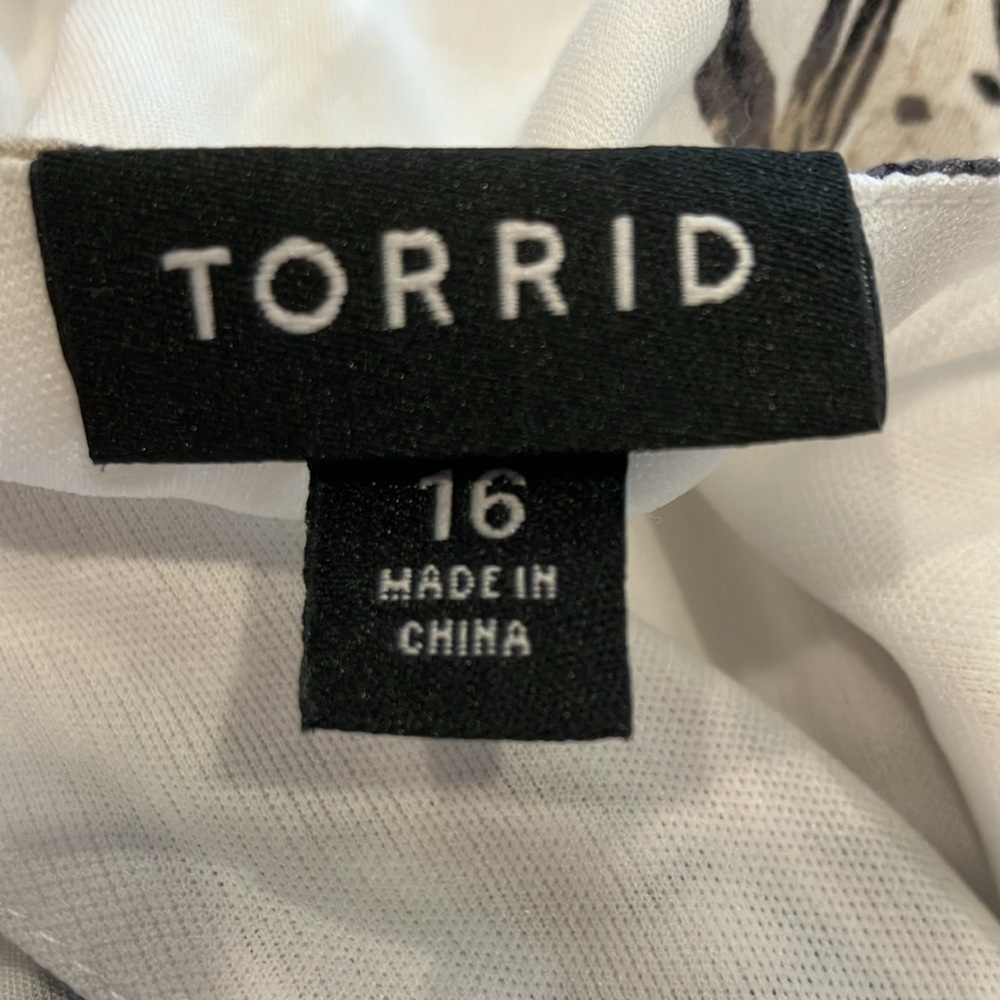 Torrid | Floral Shorts Romper with Open Front Skirt - Picture 8 of 9